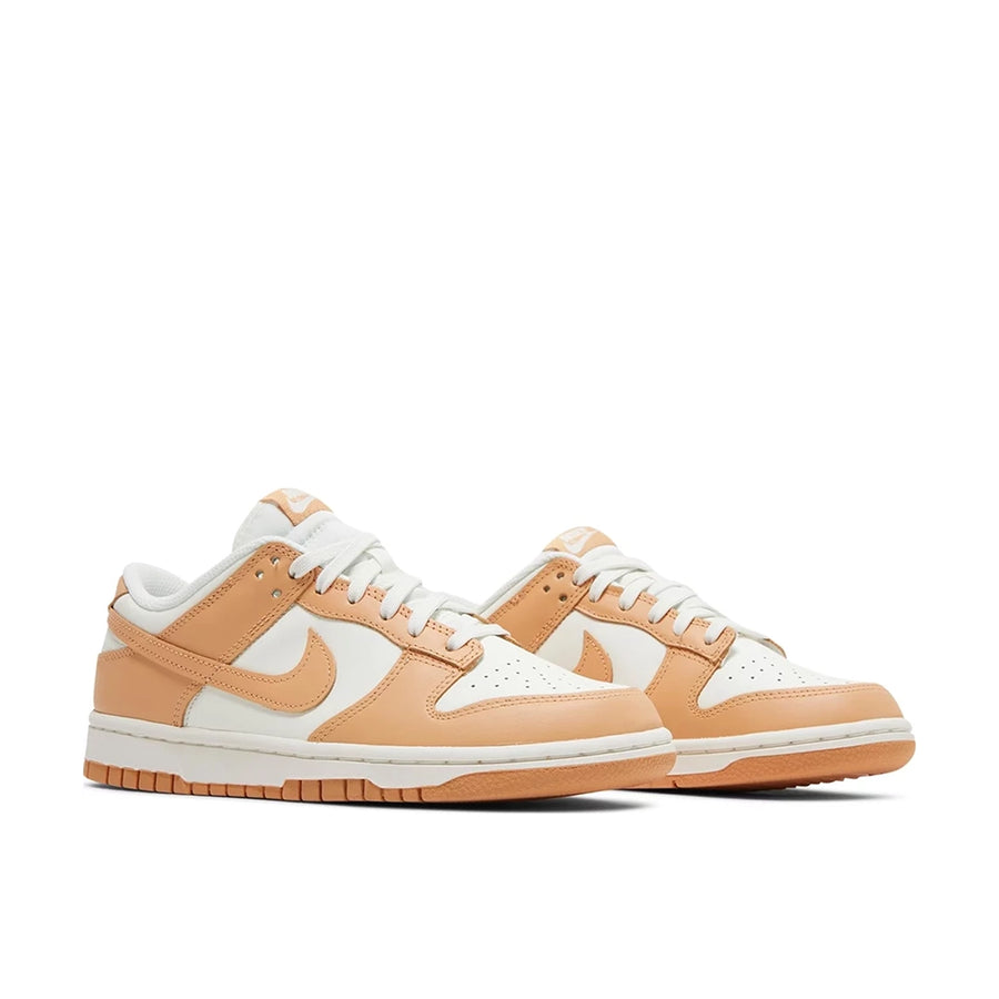 Pair of Nike Dunk Low Harvest Moon (W) in white and light brown.