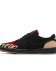 Side of Nike Jordan Air 1 low basketball shoes are in a black, beige and red colourway.
