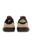 Heels of the Nike Jordan Air 1 low basketball shoes are in a black, beige and red colourway.