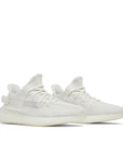 A pair of adidas Yeezy Boost 350 v2 Bone sneakers