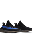 A pair of adidas Yeezy Boost 350 v2 Dazzling Blue sneakers
