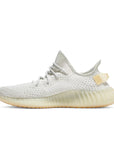 Side of the adidas Yeezy Boost 350 v2 Light sneaker