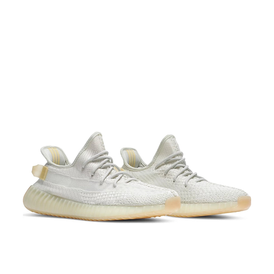 A pair of adidas Yeezy Boost 350 v2 Light sneakers