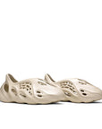 A pair of adidas Yeezy Foam RNNR Sand sneakers