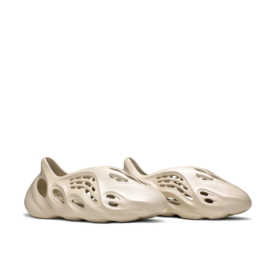 A pair of adidas Yeezy Foam RNNR Sand sneakers