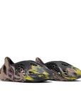 A pair of adidas Yeezy Foam Runner MX Carbon sneaker