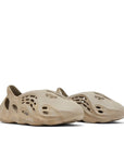 A pair of adidas Yeezy Foam Runner Stone Sage sneakers
