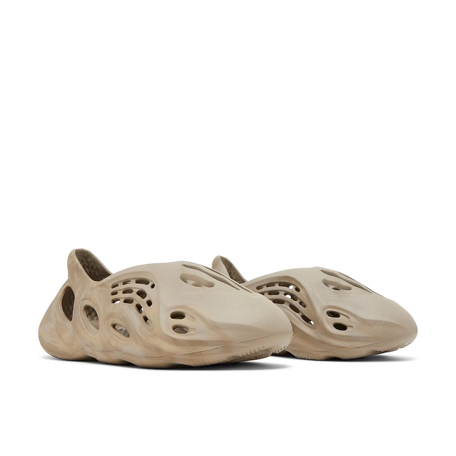 A pair of adidas Yeezy Foam Runner Stone Sage sneakers