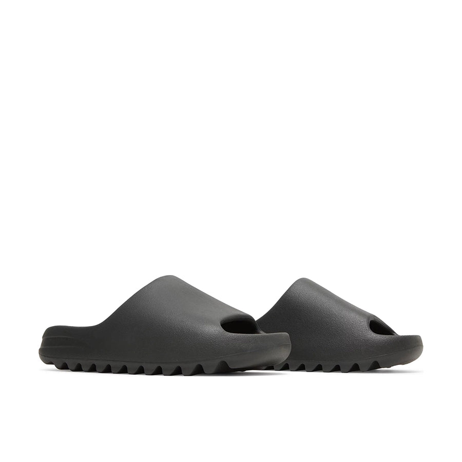 A pair of adidas Yeezy Slide Onyx sneakers