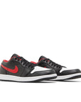 Pair of Jordan 1 Low White Toe in black, red and white.