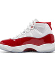 Side of Jordan 11 Retro Cherry (2022) in red and white