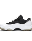 Side of Jordan 11 Retro Low Reverse Concord in Black and White