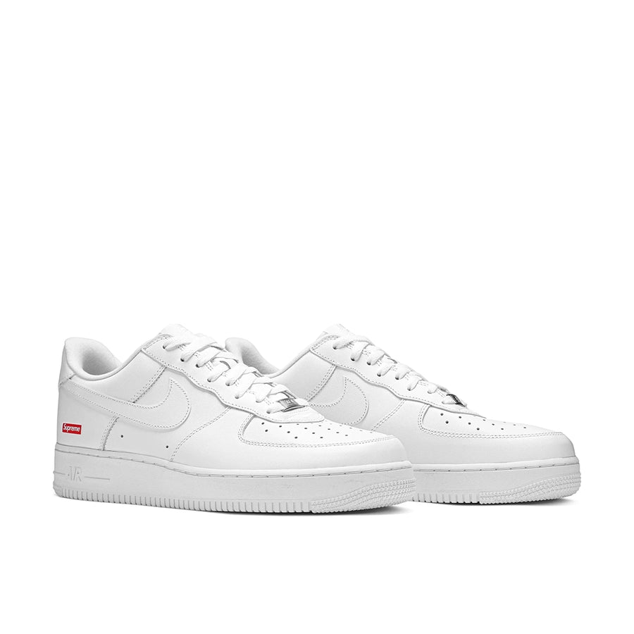 A pair of Nike Air Force 1 Low Supreme White sneaker in white