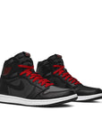 A pair of Nike Air Jordan 1 basketball shoes in black satin gym red colour