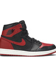 Side of Nike Air Jordan 1 basketball shoes in black and red Bred Banned colour