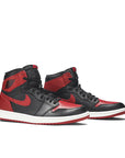 A pair of Nike Air Jordan 1 basketball shoes in black and red Bred Banned colour