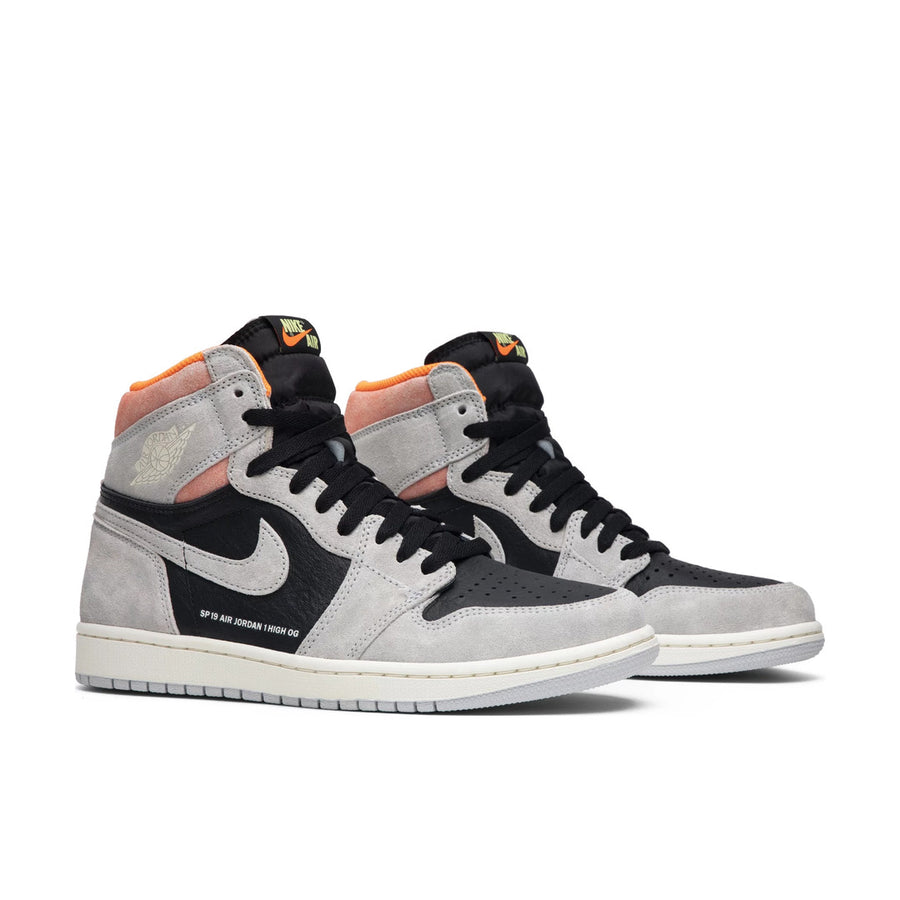A pair of Nike Air Jordan 1 basketball shoes in grey hyper crimson colour