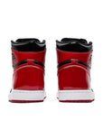 Heels of the Nike Air Jordan 1 High OG Patent Bred basketball shoes in black and red