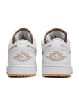 Heels of the Nike Air Jordan 1 Low Hemp White basketball shoe is in a white and hemp colourway.
