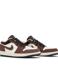 A pair of Nike Air Jordan 1 Low Mocha sneakers white, brown and pink