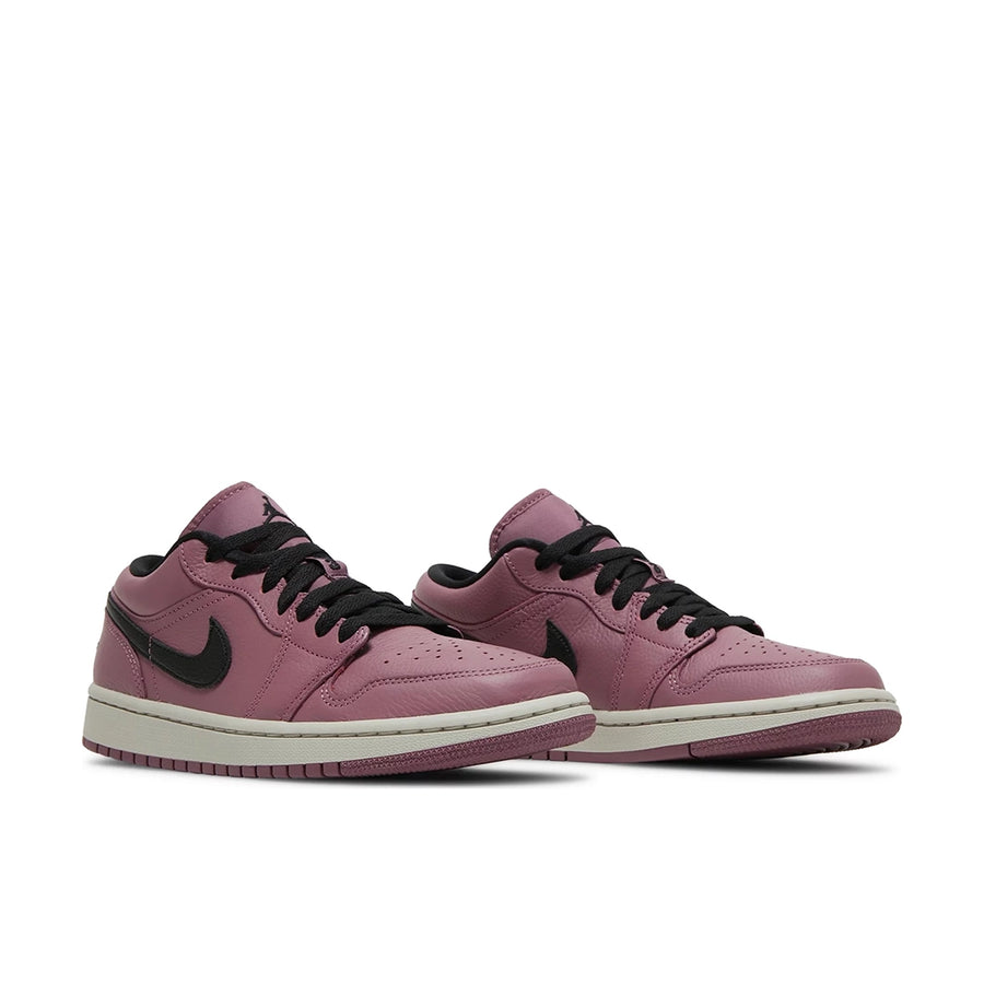 A pair of women's Nike Air Jordan 1 Low Mulberry sneakers in purple and black