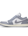 Side of the Nike Air Jordan 1 Low Vintage Grey Basketball Shoes in grey and white