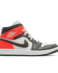 Side of the Jordan 1 Mid 'light Orewood Brown' is in a black and red colourway
