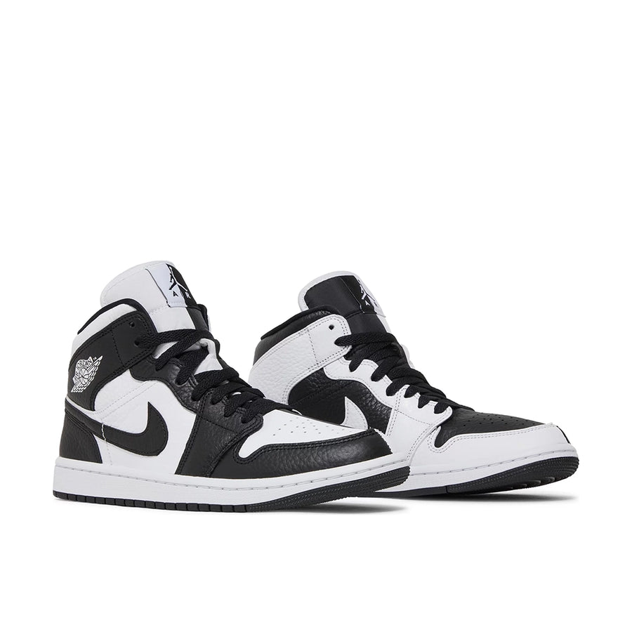A pair of Jordan 1 Mid 'Split Black White' is in a black and white colourway