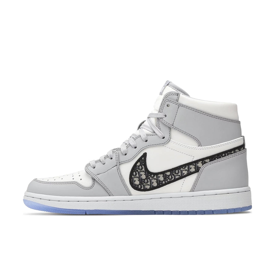 Side of the Nike Air Jordan 1 Retro High Dior sneakers in grey and white