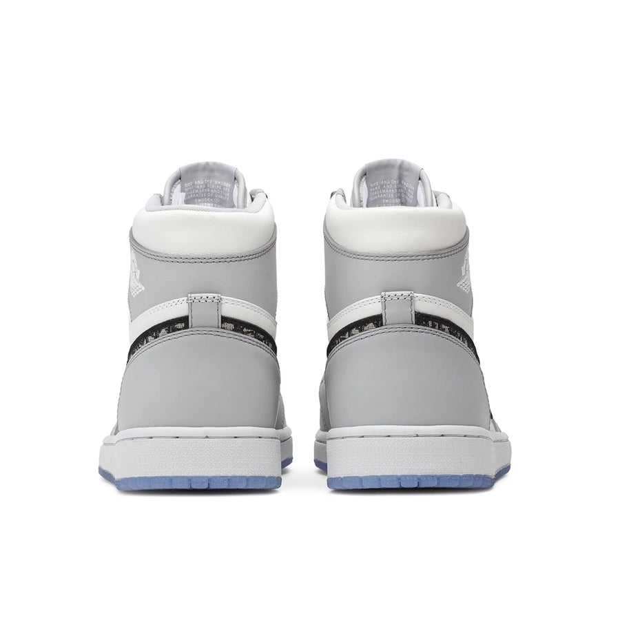 Heels of the Nike Air Jordan 1 Retro High Dior sneakers in grey and white