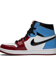 Side of the Nike Air Jordan 1 Retro High OG Fearless UNC Chicago basketball shoes in white and blue