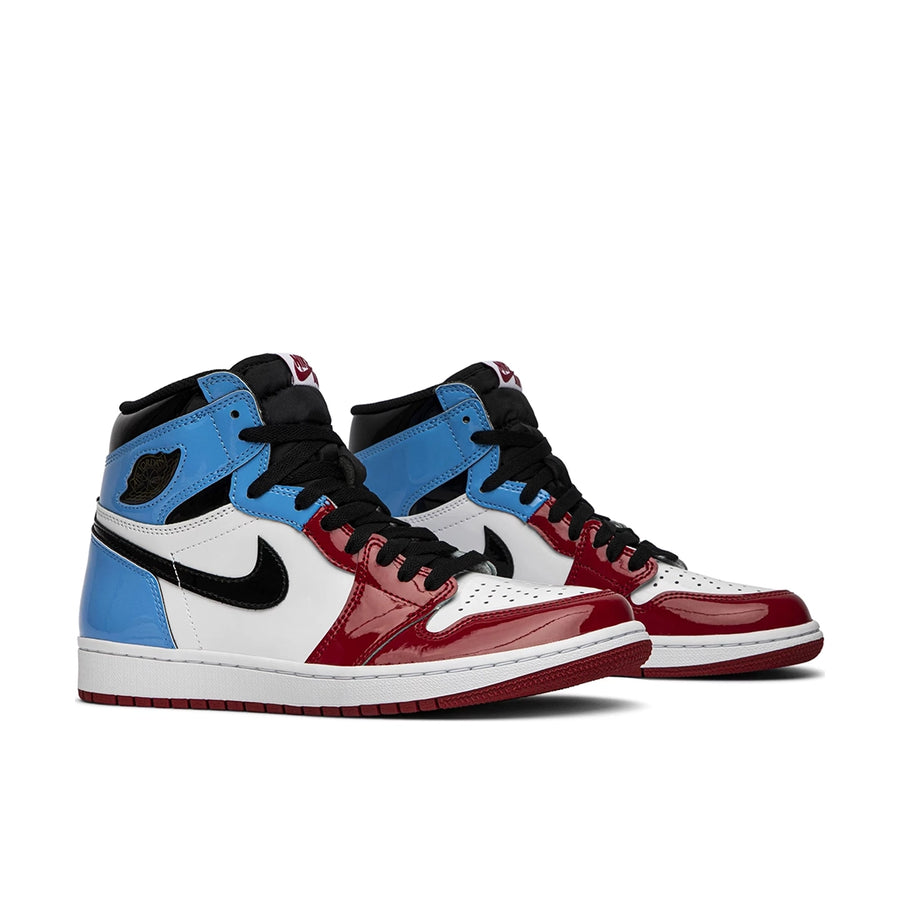 A pair of Nike Air Jordan 1 Retro High OG Fearless UNC Chicago basketball shoes in white and blue