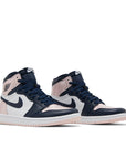 A pair of Nike Air Jordan 1 High Atmosphere basketball shoes are in pink, black and white.