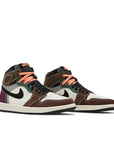 A pair of Nike Air Jordan 1 High OG Crafted basketball shoes in mixed colour