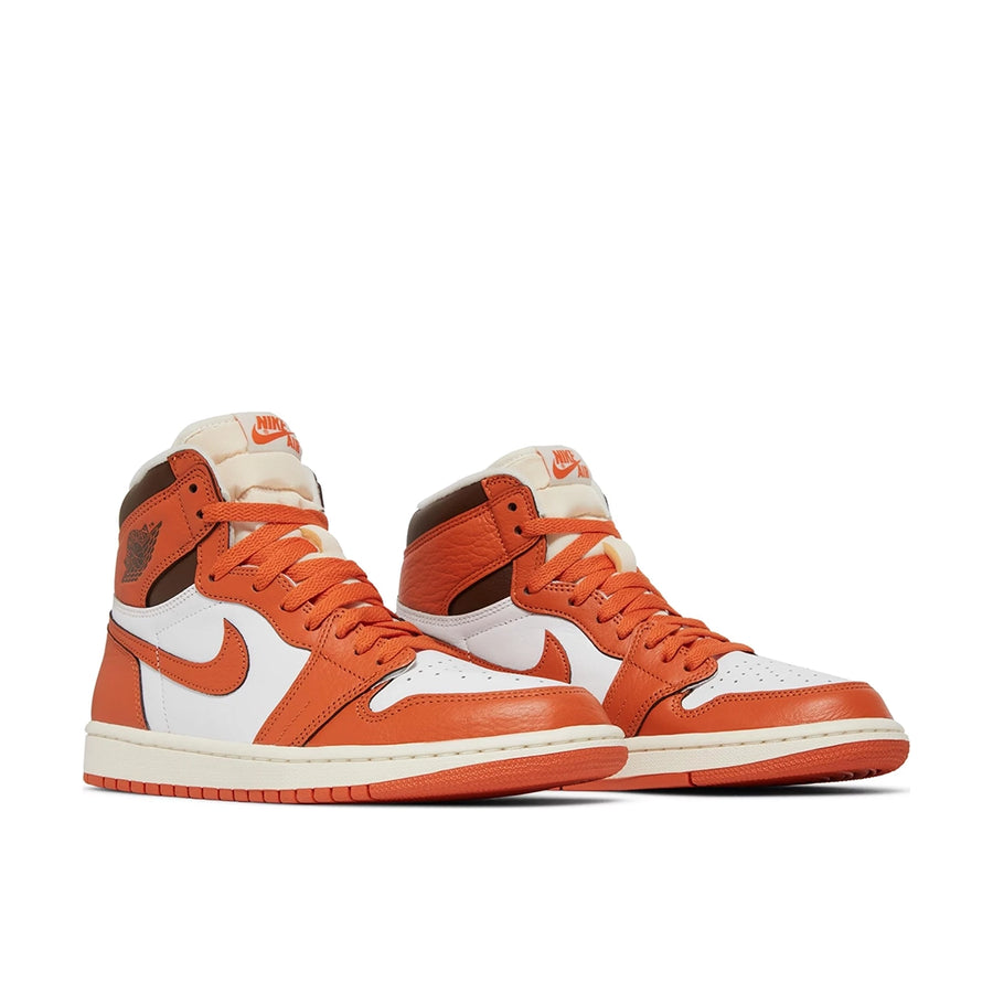 A pair of Air Jordan 1 High OG 'Starfish' is in a white, orange and chocolate brown colourway