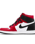 Side of the women's Nike Air Jordan 1 Retro High Satin Snake Chicago sneakers in black, red and white