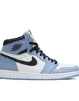 Side of Nike Air Jordan 1 Retro High White University Blue Black basketball shoes in white and blue