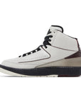 Side of the Nike Air Jordan 2 Retro A Ma Maniere sneakers in white and burgundy