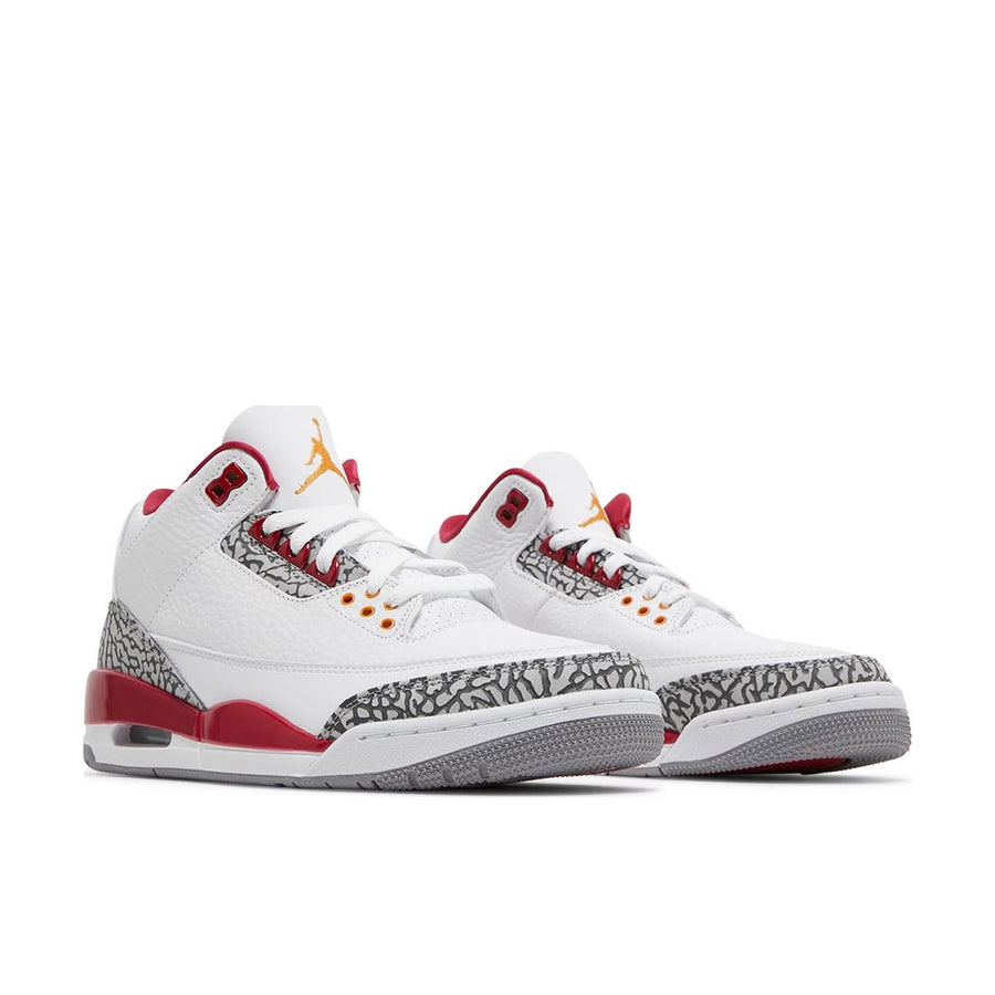 A pair of Nike Jordan Air 3 basketball shoes in a white and cardinal red colour with an elephant print