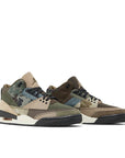 A pair of Nike Jordan Air 3 basketball shoes in a patchwork camo colour