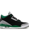 Side of Nike Jordan Air 3 basketball shoes in a black and pine green colour with an elephant print