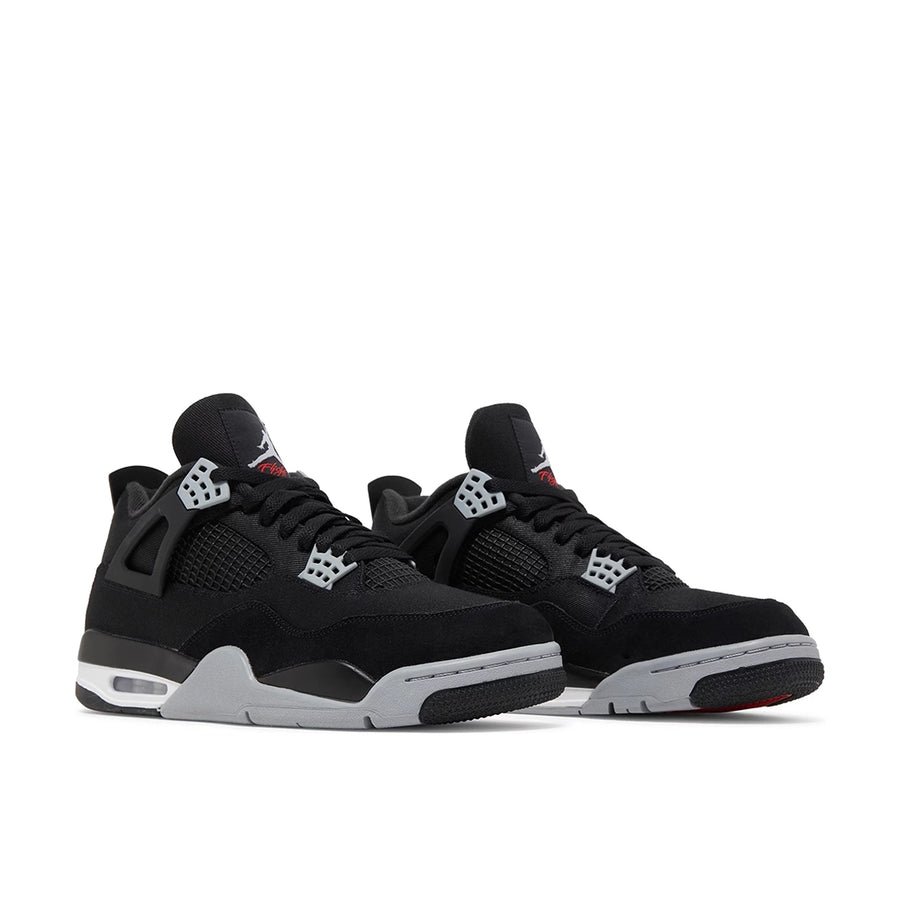 A pair of the Nike Air Jordan 4 retro black canvas basketball shoes are in an all black colourway.