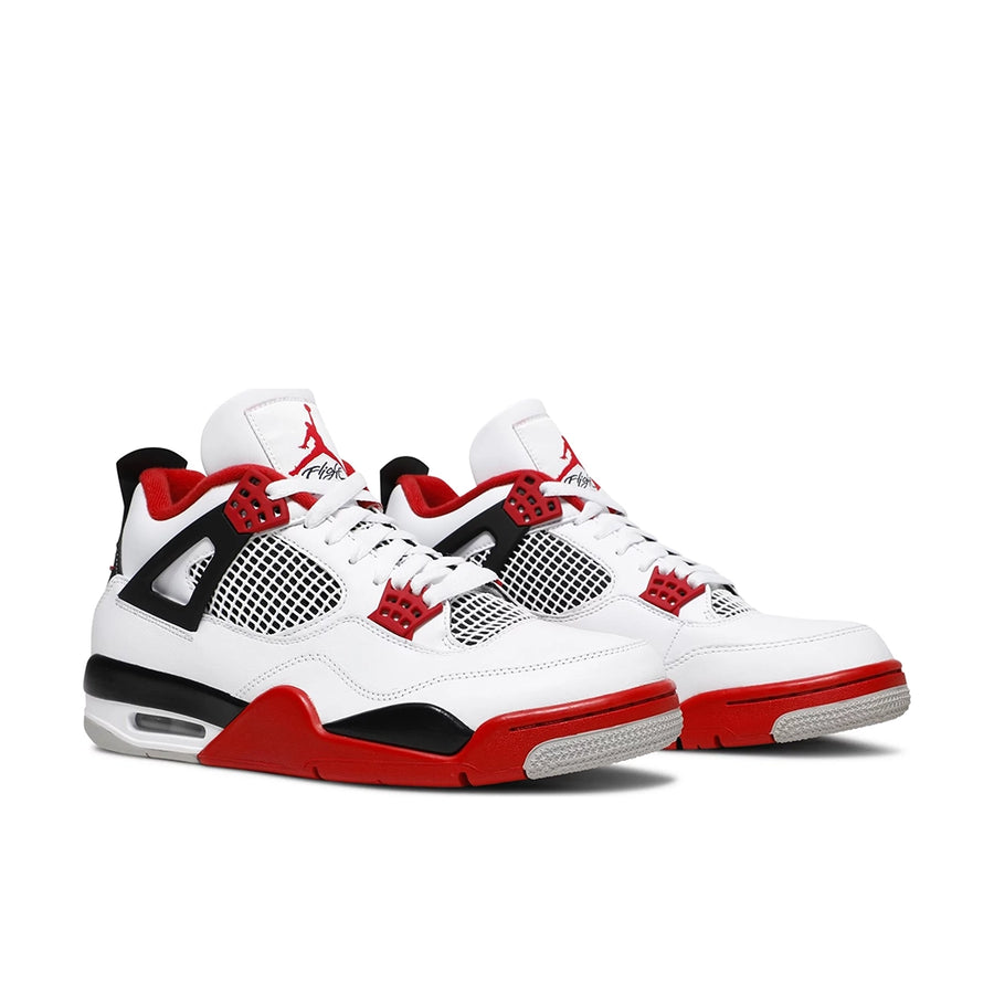 A pair of Nike Air Jordan 4 Retro Fire Red (2020) basketball shoes in white and red