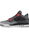 Side of Nike Air Jordan 4 retro infared basketball shoes in a  white, black and grey colourway.
