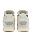 Heels of the women's Nike Air Jordan 4 Retro Off-White sail sneakers in cream