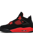 Side of the Nike Air Jordan 4 Retro Red Thunder basketball shoes in black and red