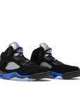 A pair of Nike Air Jordan 5 Retro Racer basketball shoes in black and blue