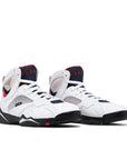 A pair of Nike Air Jordan 7 Retro BCFC Paris Saint-Germain PSG basketball shoes in white, blue and red