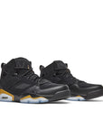 A pair of Nike Jordan Flight Club 91 basketball shoes in black and metallic gold