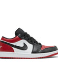 Side of the Nike Air Jordan 1 Low Bred Toe sneakers in black and red
